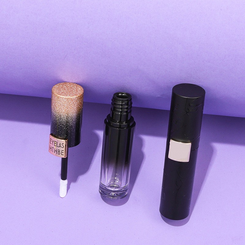 A Set Of Iridescent Mascara Tubes, A Centrally Pressable Lipstick Tube, And Liquid Eyeliner Tubes - Image 2