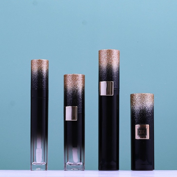 A Set Of Iridescent Mascara Tubes, A Centrally Pressable Lipstick Tube, And Liquid Eyeliner Tubes
